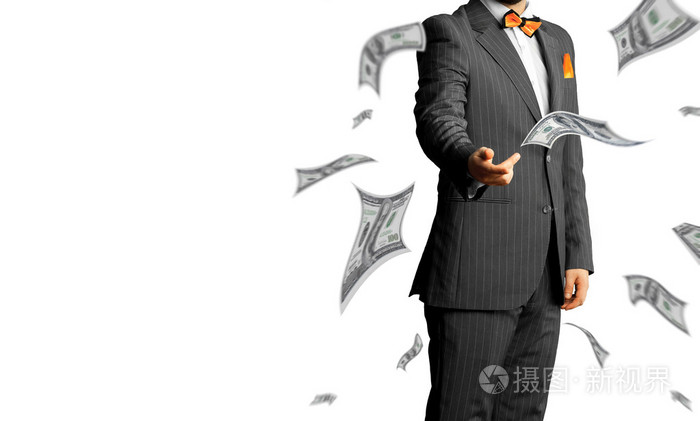 一套西装的商人抛出大量的钱白坝上孤立