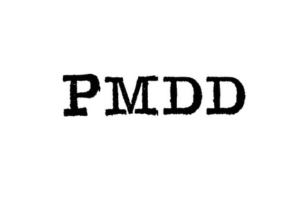 从一个白色背景的打字机 Pmdd 词