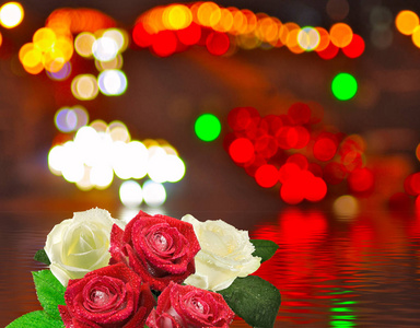 玫瑰花朵上城市灯光背景