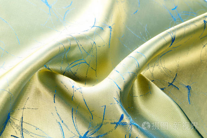 丝绸面料是绿色的图案.