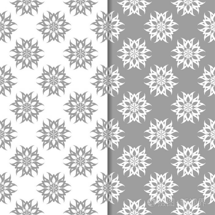 白色和灰色的花卉背景。纺织品和墙纸的无缝图案集