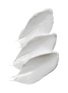 白色的 reamy 纹理被隔离在白色背景上。白底面霜涂抹