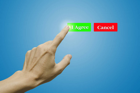 手指和按钮我同意/取消按钮在蓝色背景, 手商人照片