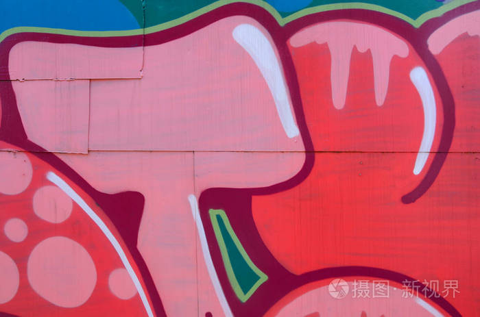 街头艺术。红色色调的彩色涂鸦画片段的抽象背景图像