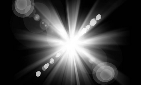 黑色光晕抽象的镜头光晕照在黑色的背景照片