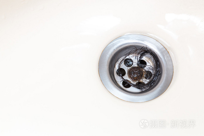 束的头发被困在浴室盆地排水口照片 正版商用图片0pqhi1 摄图新视界