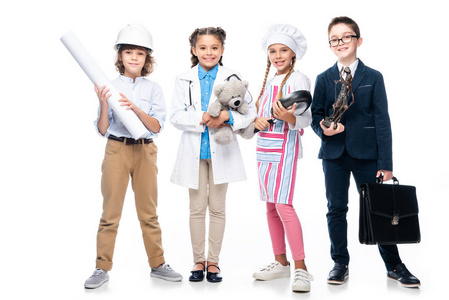 快乐的学童在不同行业的服装隔离白色