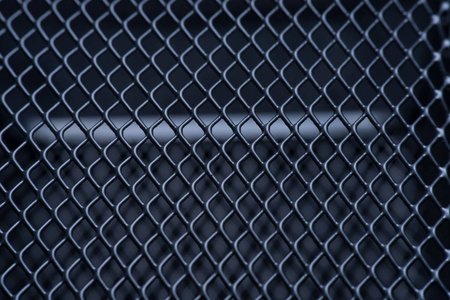 宏观灰色金属网格与照明效果.背景单色.背景金属.文本位置照片