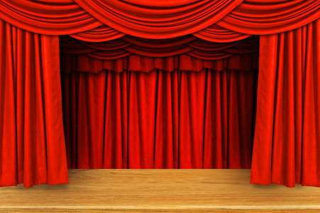 红色的窗帘和木制舞台地板照片