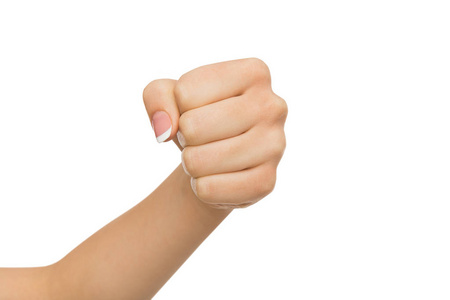 人类的手冲手势,女人握紧的拳头,准备冲照片