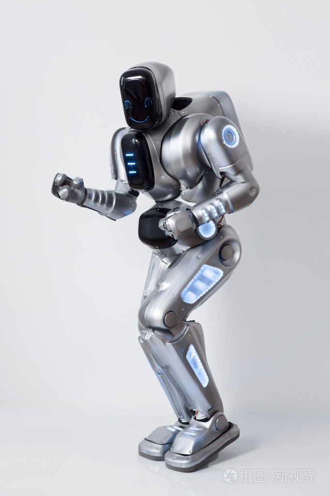 性格开朗的机器人跳舞杜松子酒的白色背景照片-正版商用图片0pyvpo-摄