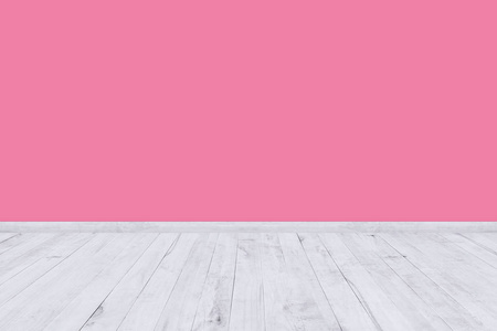 粉红色的房间墙与木地板纹理