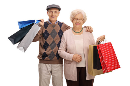 幸福的老年夫妇，拎购物袋