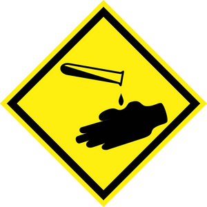 腐蚀保护带有腐蚀性物质符号的黄色危险标志照片