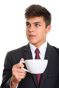年轻英俊的商人持有思维则是一杯咖啡