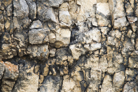石墙上的鹅卵石。岩石石墙的自然背景