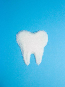 从糖在蓝色背景, 符号的牙齿