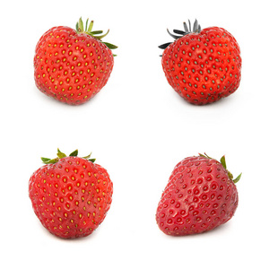 许多不同的草莓在白色背景下, 与草莓隔绝, 在一张纸上有很多不同