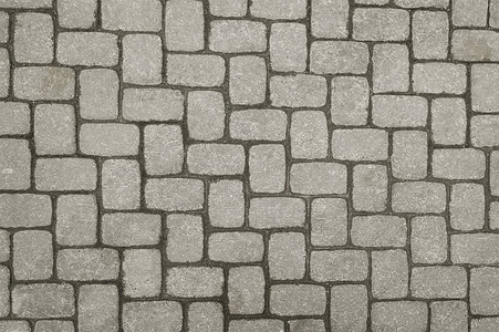 古老的灰色石头路面背景照片