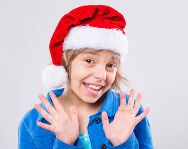 圣诞老人帽的小女孩图片
