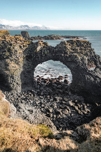 冰岛 Snaefellsnes 半岛 Arnarstapi 地区典型的冰岛日出日落悬崖景观