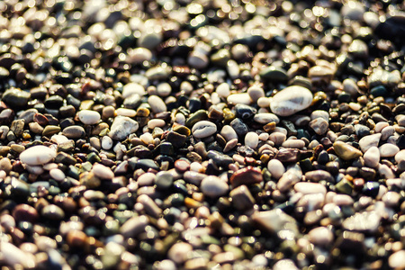 石头和海，卵石海滩纹理，墙砾石石器，海滩上的卵石图案作为背景，灰色海卵石上砂背景 旅游概念，土耳其，佛罗里达州，迈阿密