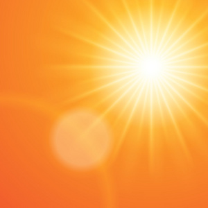 太阳与镜头光晕橙色的夕阳的天空照片