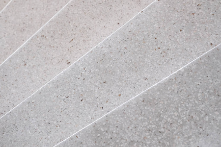 楼梯水磨石抛光石材人行道和地板, 花纹和彩色表面大理石和花岗岩石, 材料为装饰背景质地, 室内设计。选择性聚焦浅自由度