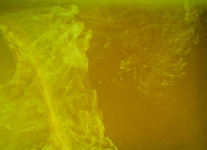 抽象彩色背景。黄烟，墨水在水中，宇宙的模式。抽象运动，冻结多色流的油漆。软焦点，模糊背景水平合影