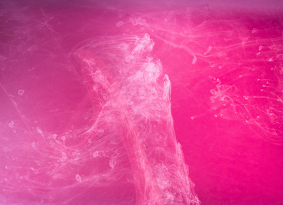 抽象彩色背景。粉红色的烟雾，墨水在水中，宇宙的模式。抽象运动，冻结多色流的油漆。软焦点，模糊背景水平合影