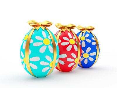 三个手工制作的复活节彩蛋，用金色的丝带