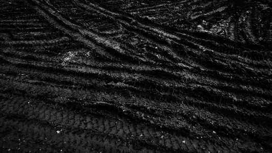 黑色泥浆地面纹理或背景关闭照片