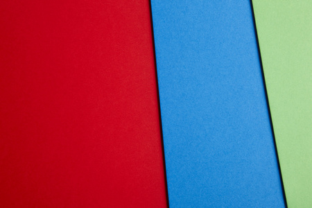 彩色的硬纸板背景的红色蓝绿色调。复制空间