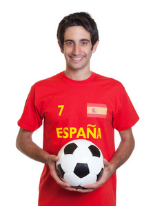 黑色的头发与球的快乐西班牙足球迷