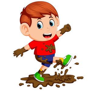 小男孩喜欢在泥巴里玩耍.照片