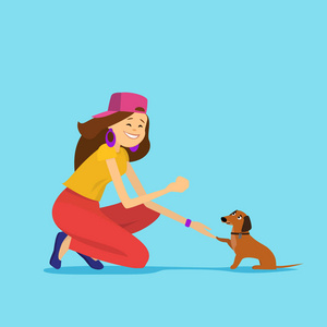 年轻女子训练她的狗