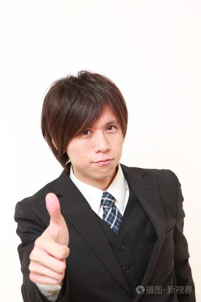 日本商人与手势竖起大拇指