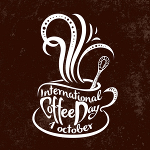 国际咖啡日。10月1日。食物事件概念。用刻在杯子里的事件名称手工制作的刻字