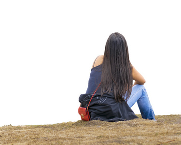 背影女人坐在草地上照片