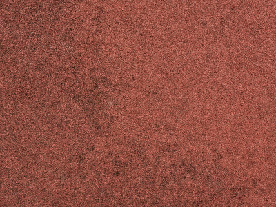 体育和儿童游乐场的红色防护橡胶涂层。纹理背景