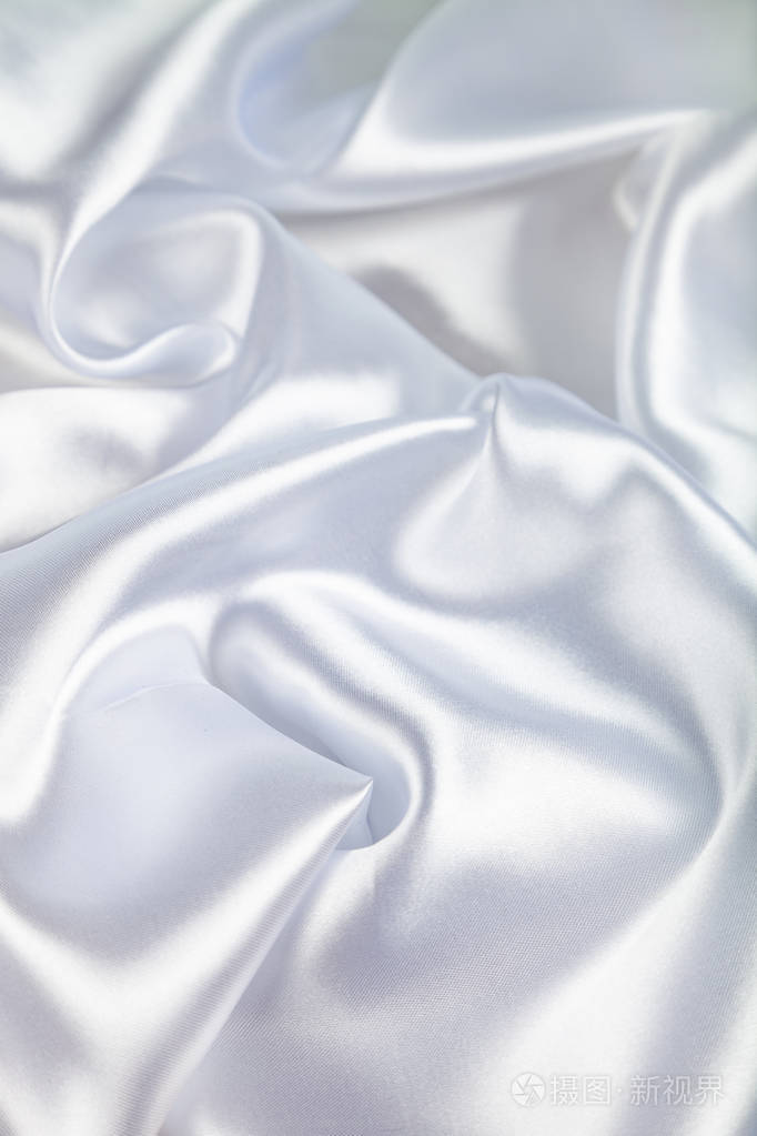 带褶皱的白色真丝织物.美丽的背景