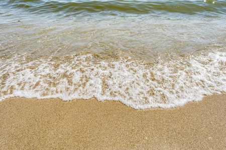 海岸边波浪, 沙滩上晴朗晴朗的日子, 特写自然抽象背景