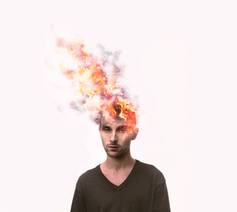 人的头爆炸和燃烧的火从消极的想法.消极的人情感概念.心理健康.