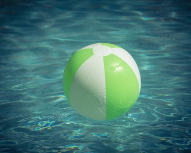 一个明亮的绿色海滩球在蓝色游泳池, 漂浮在清爽的游泳池与波浪反射在夏天太阳。活动假期背景。孩子的救命稻草。游泳池阳光明媚的一天