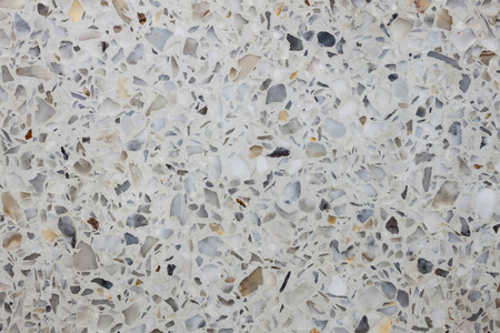 沙砾石水磨石纹理黑沙砾石水磨石磨砺石背景和水磨石地板表面石墙