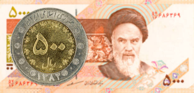 500伊朗阿曼里亚尔硬币反对5000伊朗阿曼里亚尔附注正面