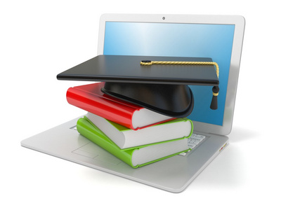 毕业帽和笔记本电脑上的书。互联网，在线学习的概念。3d