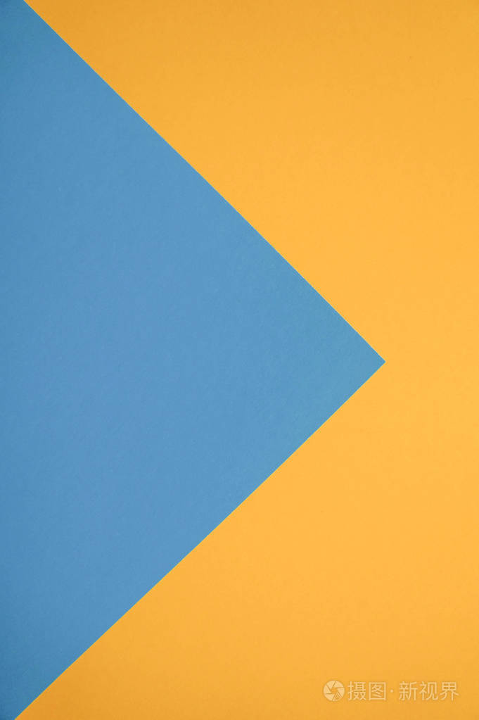 独特的平躺背景与彩色纸页.黄色和蓝色