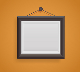 橙色的墙上挂着的空白图片框模板