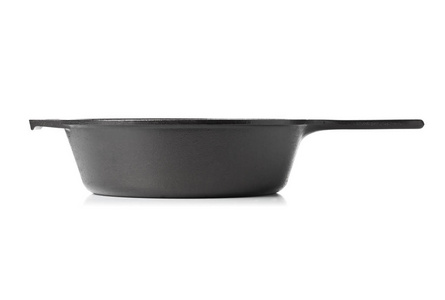 空的, 干净的黑色铸铁锅或荷兰烤箱侧面查看白色背景
